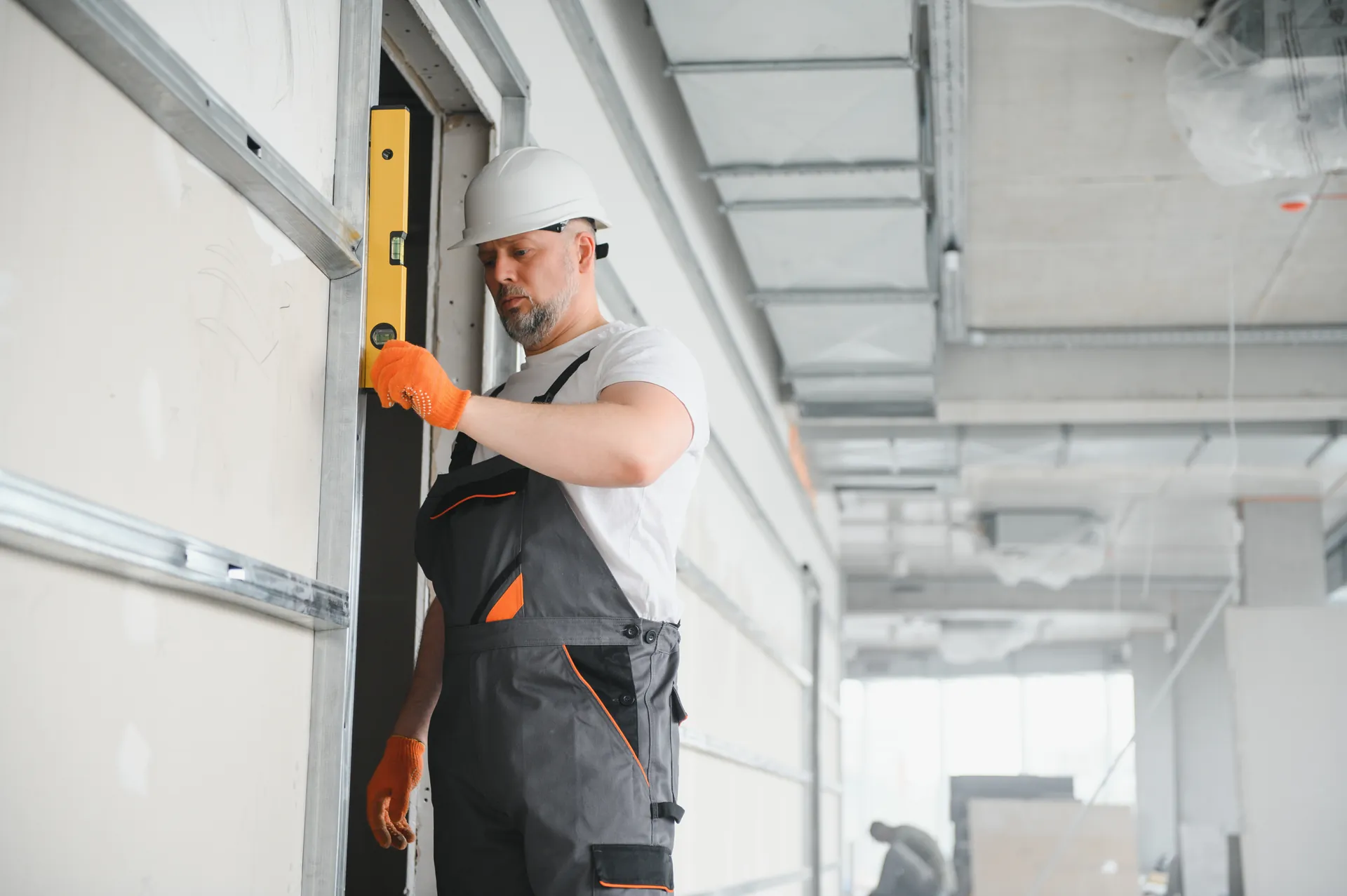 Professional tradesperson in safety gear — on-site garage door repair